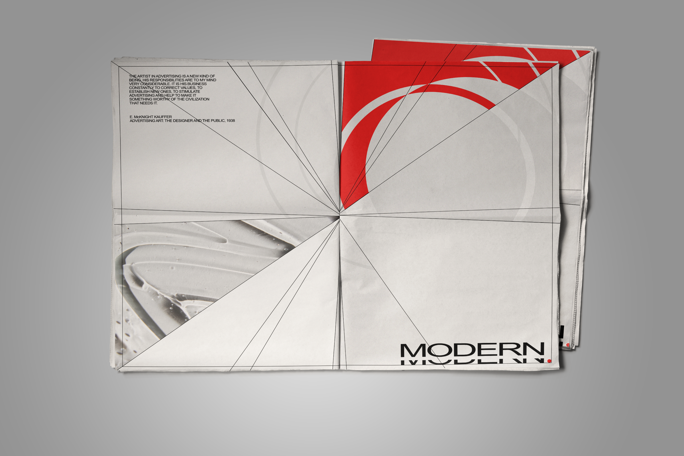 Folded Modern Underground print opened to a spread with large black letterforms